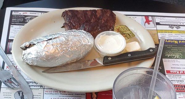 Flank steak well done with baked potato