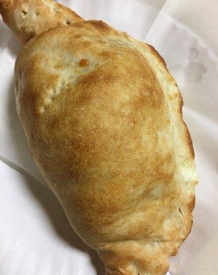 Fresh out of the oven cheese calzone.