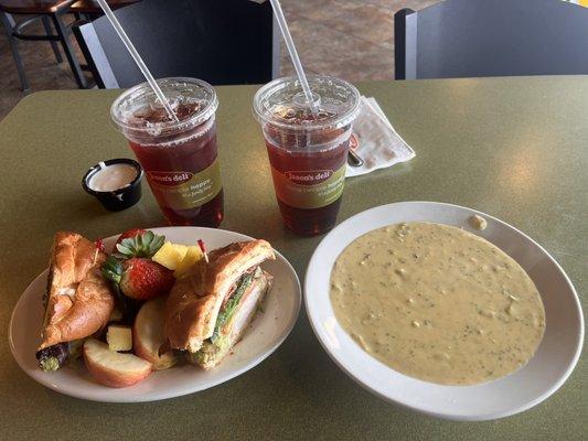 Club sandwich with fruits and a bowl broccoli cheddar soup. Favorite place to sit down and have a quiet lunch!