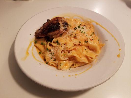 Fettuccine Alfredo with calabrian chili oil and chicken thigh confit