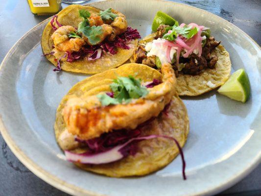 Shrimp taco upfront, tempura shrimp and braised chicken in the back.