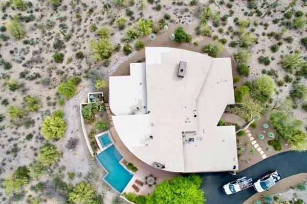 The crew coating the roof on this gorgeous custom home in Tucson