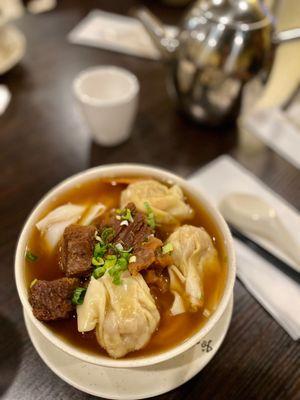 Beef brisket and wonton wide rice noodle soup