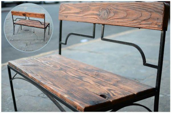 Reclaimed wooden bench with metal frame.