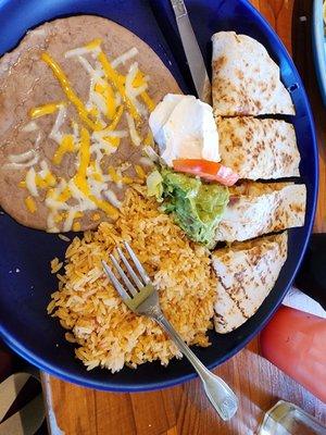 Shrimp quesadillas with beans, rice and sour cream/guacamole