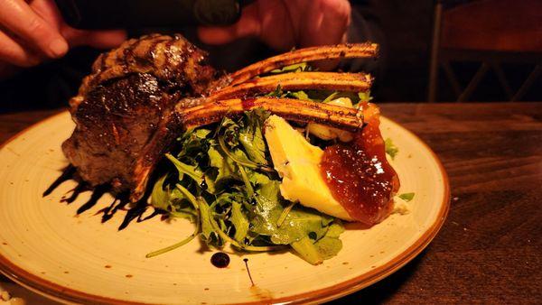 Bone in elk tenderloin.  Arugula watercress salad, port cheeries balsamic olive oil, aged gorgonzola.