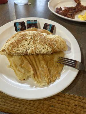 Pancakes are flimsy and uncooked I can still taste the batter in it and the service was bad