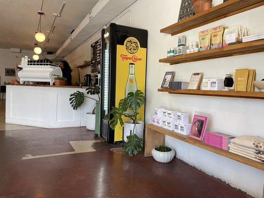 Espresso machine, and Merch wall.