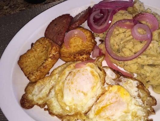 Best mangu in NC made with mashed boiled green plantains and butter, eggs, fried cheese and salami! Yum!