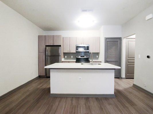 Austin apartment kitchen with light cabinets.