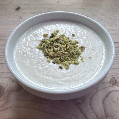 Lebanese Rice Pudding topped with pistachios.