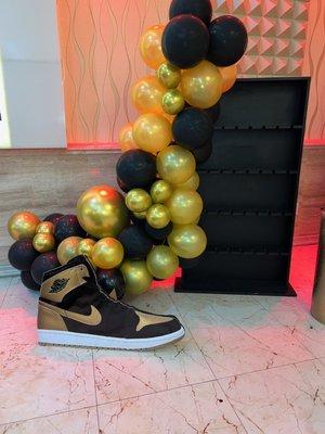 Sneaker Theme Cascading Arch with Champagne Wall