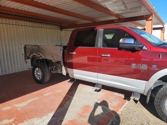 Dodge Laramie getting repaired from equipment moving around in the bedside and creating damage. We can fix your fleet work trucks too!