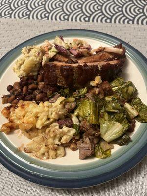 Shared 2 plates and still have leftovers !! Ribs, brisket, greens, mac and cheese, cole slaw, cowboy beans. All super yummy.