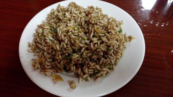 Chatpatey (crispy puffed rice mixed with spices, onion and mustard oil)