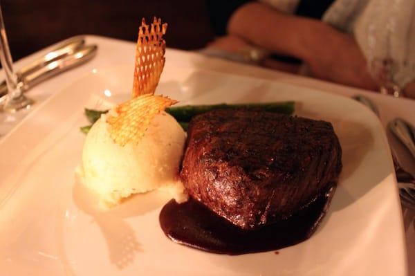 filet mignon served with mashed potatoes and asparagus