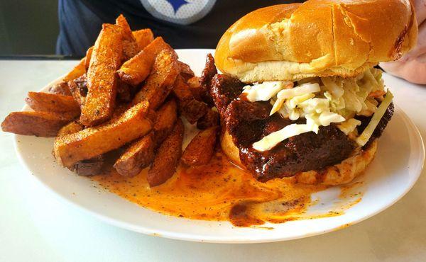 Nashville hot chicken sandwich with coleslaw (its spicyyy) with French fries.