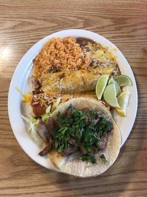 Combo plate, a carnitas street taco, a chicken enchilada and a tamale with rice and beans.