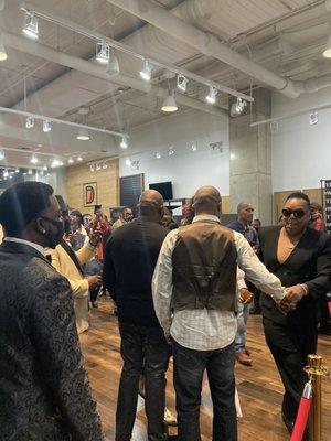 The young man in the black glasses coming up is Stevie Edwards a prominent black Designer from Chicago...