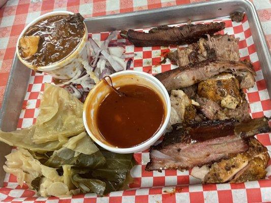 Three meat plate of ribs, sliced brisket and chicken with BBQ gumbo and cabbage with BBQ sauce on the side.  (3 Meat Plate with 2 Sides)