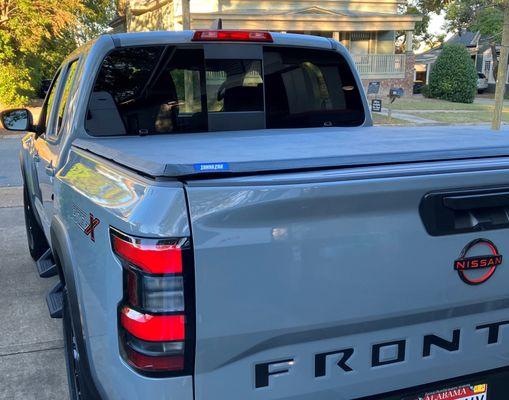 TonnoPro Tri-Fold Tonneau Cover installed on 2024 Nissan Frontier Pro X