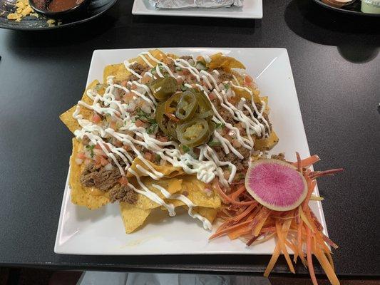 Beef Nachos (soo good), a fresh slice of water radish and carrots.