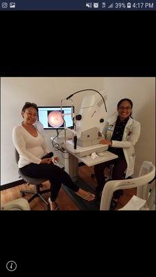 Dr. Tina using a retinal imaging camera to check the health of the back of your eye.