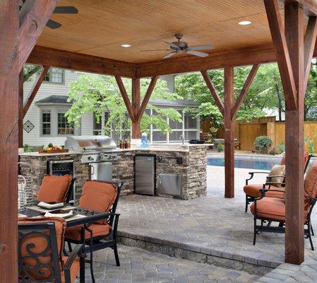 Covered outdoor kitchen and  patio in back yard