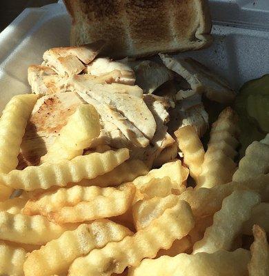 A dry turkey sandwich and grocer quality French fries.