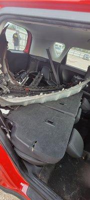 Inside the back of my vehicle. I had belongings in the storage underneath the wreckage that was difficult to get to.