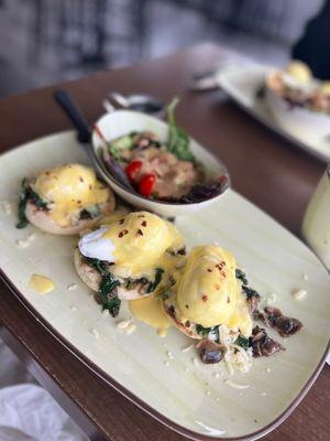 The flight of Benedict's with a side salad.