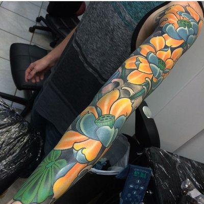 Full sleeve tattoo by Frank Mostek at Legion Art Collective