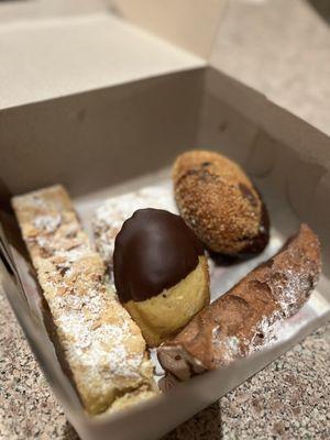 Madeline, chocolate cannoli, raspberry/almond bar, Nutella filled donut, cookie