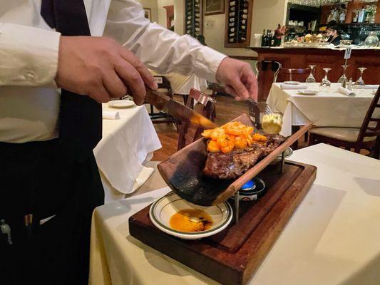 Ribeye with garlic shrimp on the tile.