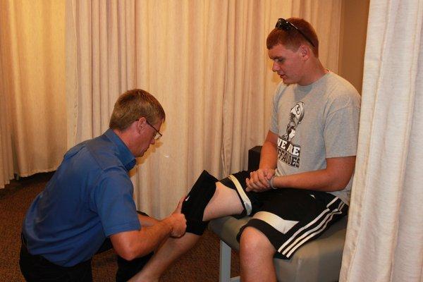 Dr. Greene treating a sports injury