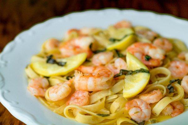 Shrimp Scampi sautéed in garlic, lemon-caper butter, basil & white wine over fettuccine