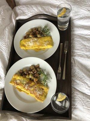 Omelette and potatoes with a fancy sauce inside.