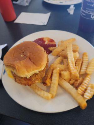 Chicken egg and cheese sandwich with fries