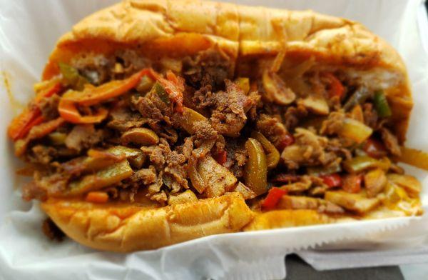 What's with the reddish hue in the Philly cheesesteak, doesn't even look like the business photo