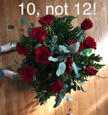 Paid over $100 for one dozen yet arrangement clearly has TEN roses plus a plastic heart.  Roses had droopy necks by day for or five.