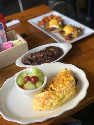 Chili omelet, avocado benny, and jalapeño hash