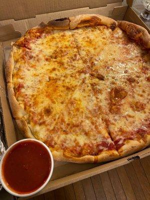 Large Pizza with a side cup of pizza sauce