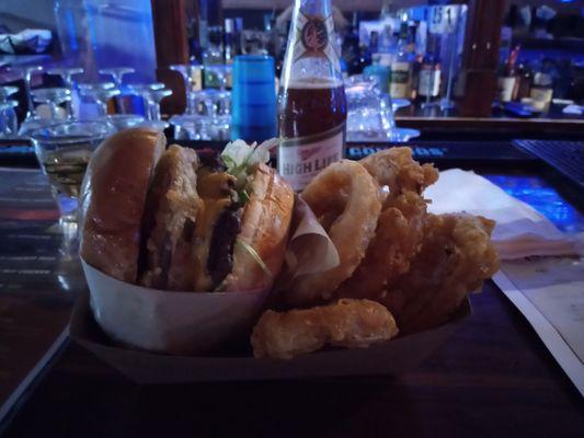 "the works" burger and a half order of onion rings