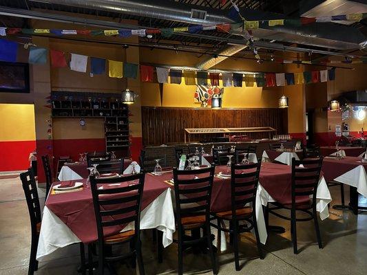 Main dining room of the restaurant with beautiful Tibetan Prayer Flags.