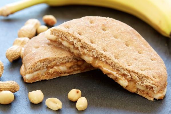 All Natural Peanut Butter and Banana Sandwich (also available in Almond Butter)...Whole Wheat Thin Bread, Banana Slices, and All-Natural PB