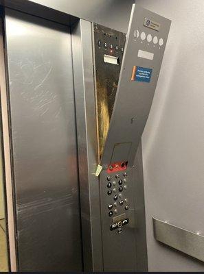 completely destroyed elevator and filthy dollar stuck in the space.