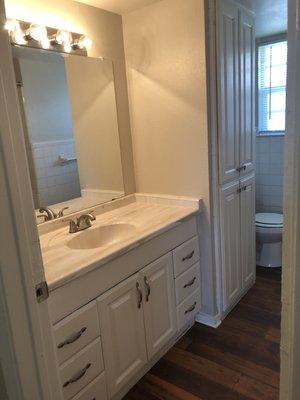 Vanity lights in the restrooms! And linens cabinets!