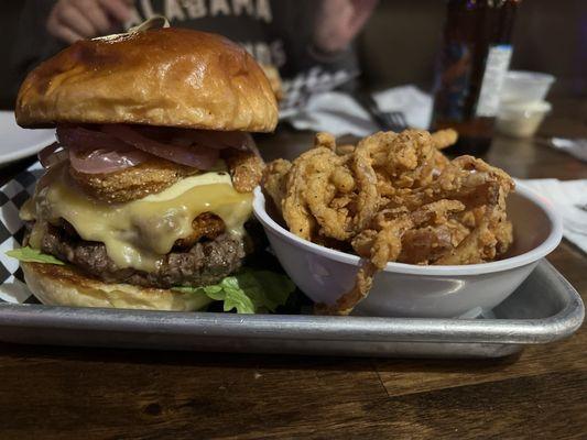 Surf and Turf burger with fried onion straws