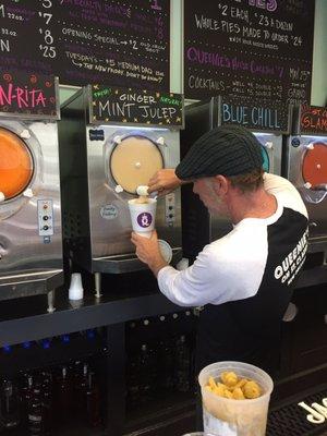 The man himself pouring a Ginger Mint julep daiquiri that he mottles Fresh ginger in.