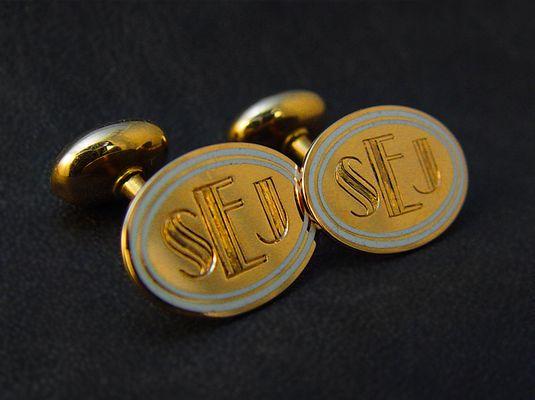 Hand engraved gold cuff links.